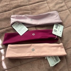 3 different shades of pink lululemon headbands